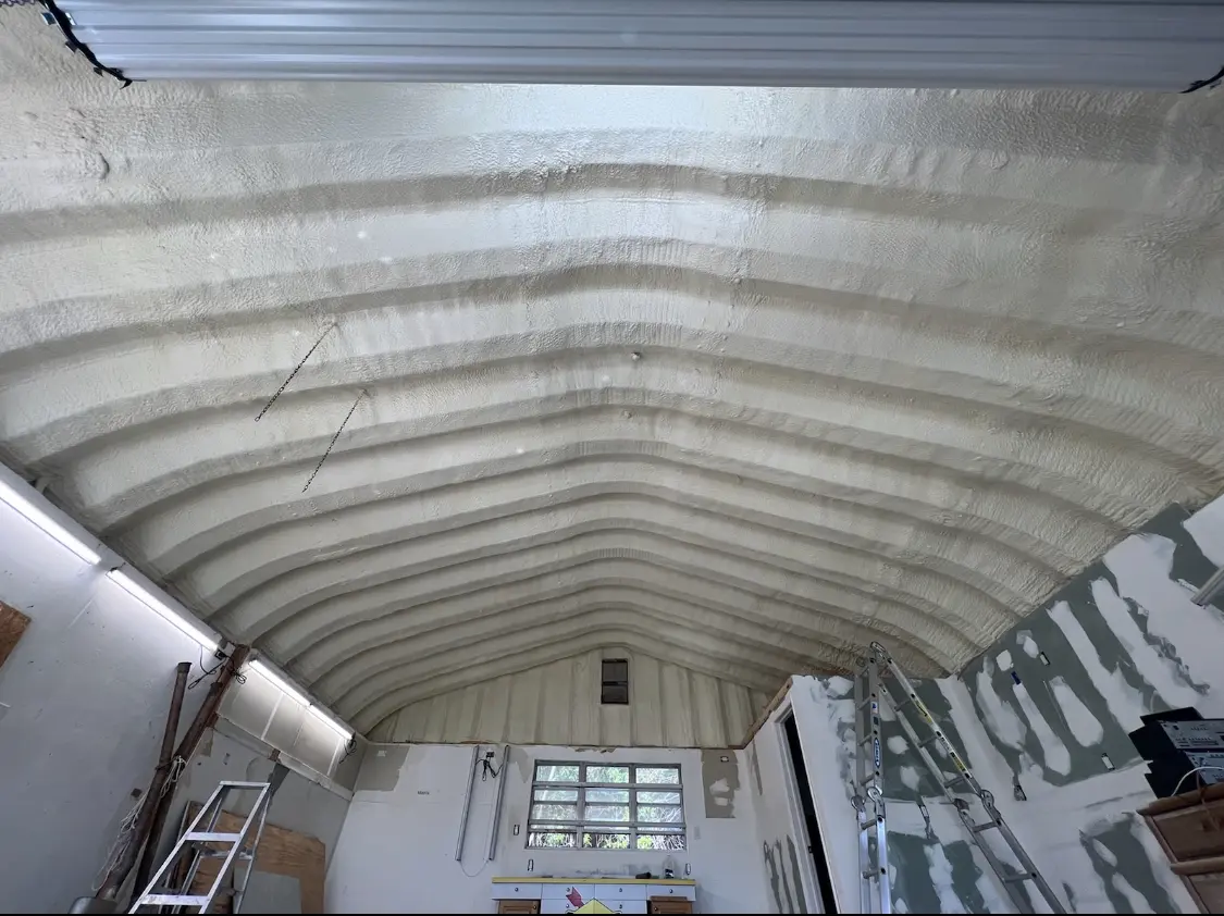Spray polyurethane foam applied to the underside of a metal roof deck in Middlesex